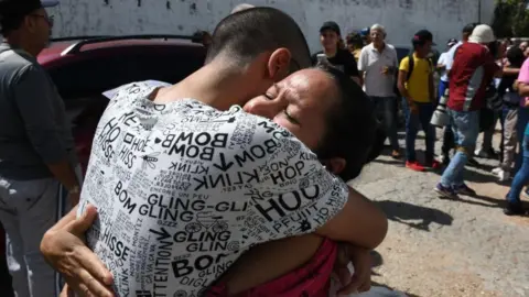 Getty Images A man and a woman hug