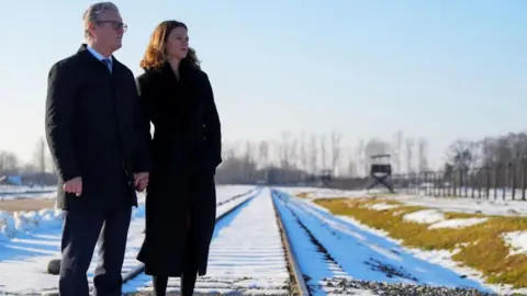 PA Media Prime Minister Sir Keir Starmer and his wife Lady Victoria, visit the Memorial and Museum Auschwitz-Birkenau, a former German Nazi concentration and extermination camp, in Oswiecim, during his visit to Poland to begin talks on a new defence and security agreement. Picture date: Friday January 17, 2025. 