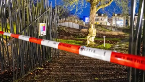 EPA Red and white police tape crosses a gate before a statue in front of a tree outside Drents Museum in Assen, the Netherlands