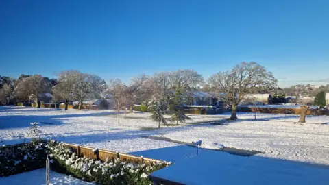 ht247 / BBC Weather Watchers A snowy landscape scene in Edinburgh, Scotland shows a large field blanketed in snow.