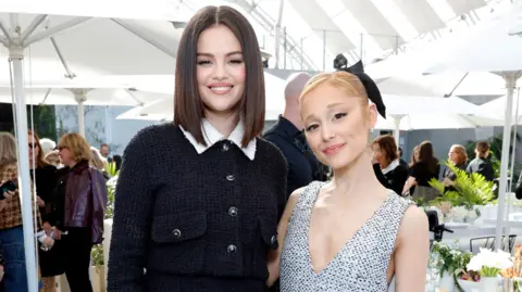 Getty Images  Selena Gomez, wearing CHANEL, and Ariana Grande, wearing CHANEL, attend the Academy Women's Luncheon presented by CHANEL at the Academy Museum Of Motion Pictures on December 10, 2024 in Los Angeles, California.