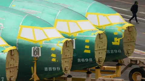 Getty Images A worker walks past Boeing 737 fuselages outside the Boeing Co. manufacturing facility in Renton, Washington, US, on Monday, Feb. 5, 2024.