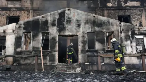 Evrim Aydin/Anadolu A view of a blackened porch at one of the entrances to a hotel badly damaged by fire in the Bolu Kartalkaya Ski Resort