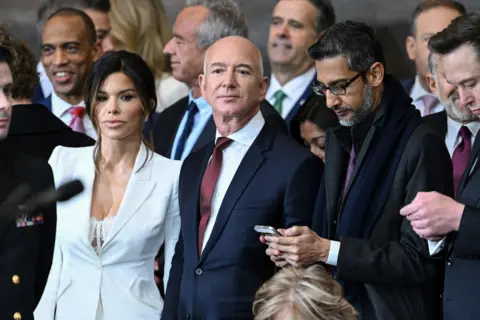 Reuters Lauren Sanchez, Jeff Bezos, Sundar Pichai and Elon Musk in a crowd of inauguration attendees