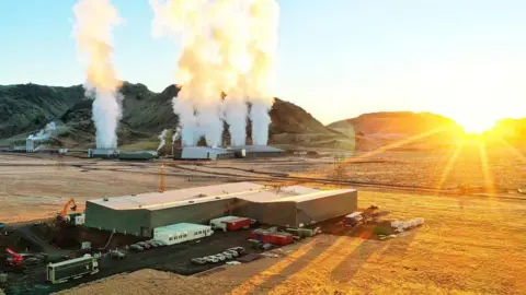 Vaxa Steam vents from a geothermal power plant, in the foreground is VAXA's plant.