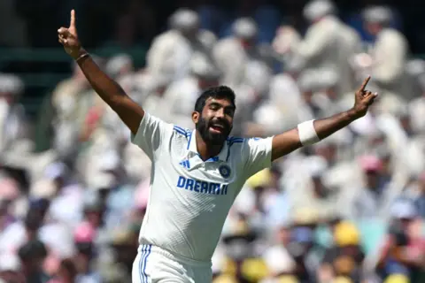 AFP India's Jasprit Bumrah celebrates a successful caught-behind appeal, dismissing Australia's Marnus Labuschagne on day two of the fifth Test match between Australia and India at the Sydney Cricket Ground on January 4, 2025. 