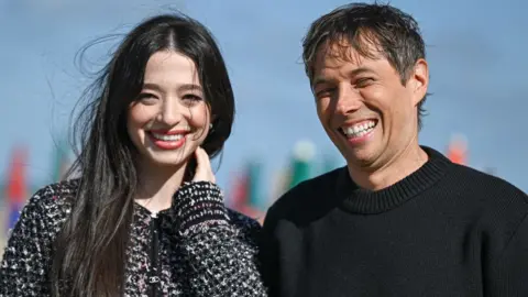 Getty Images US director Sean Baker and US actress Mikey Madison pose for a photocall during the 50th edition of the Deauville American film festival, in Deauville, on September 13, 2024