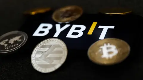 Getty Images Bybit's logo with representations of digital currency coins