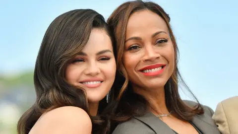 Getty Images Selena Gomez and Zoe Saldana attends the 