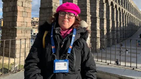 Spanish tour guide Elena Mirón wearing a bright beret 