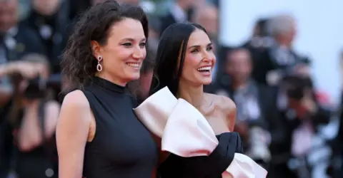 Getty Images Coralie Fargeat and Demi Moore attend the Red Carpet of the closing ceremony at the 77th annual Cannes Film Festival at Palais des Festivals on May 25, 2024 in Cannes, France