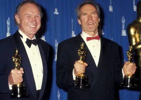 Getty Images Gene Hackman and Clint Eastwood holding their Oscars for Unforgiven