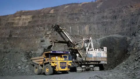 Getty Images Vehicles at a Ukrainian iron ore mine