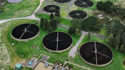 Getty Images An aerial shots of the round ponds of a water treatment plant.