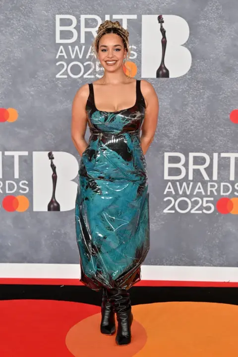 Getty Images Jorja Smith in a black and blue outfit on the red carpet 