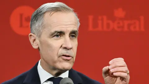 Getty Images Mark Carney, former governor of the Bank of Canada and Liberal Party leader candidate, speaks during a Liberal Party leadership debate in Montreal, Quebec, Canada, on Monday, Feb. 24, 2025.