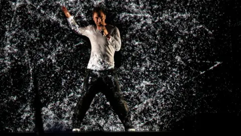 Getty Images Mans Zermerlow dances in a shower of water at the 2015 Eurovision Song Contest