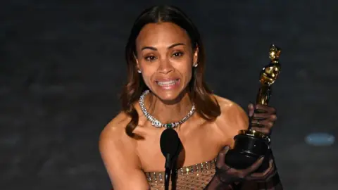 Getty Images Zoe Saldaña accepts the award for Best Actress in a Supporting Role for 