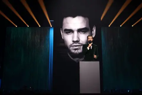 Getty Images Jack Whitehall presents a tribute to Liam Payne at Saturday night's Brit Awards